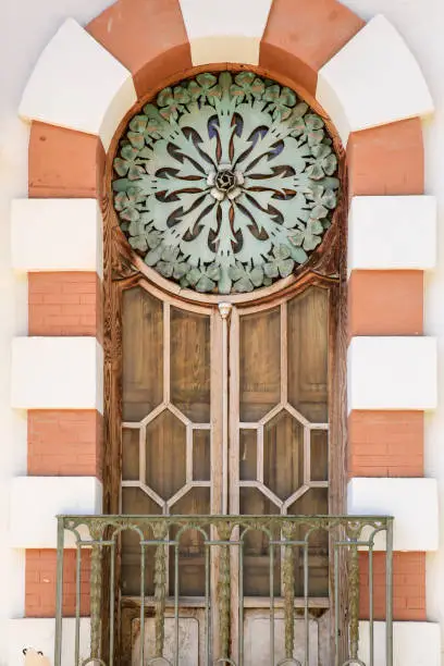 Photo of Art nouveau style window with forged metal details