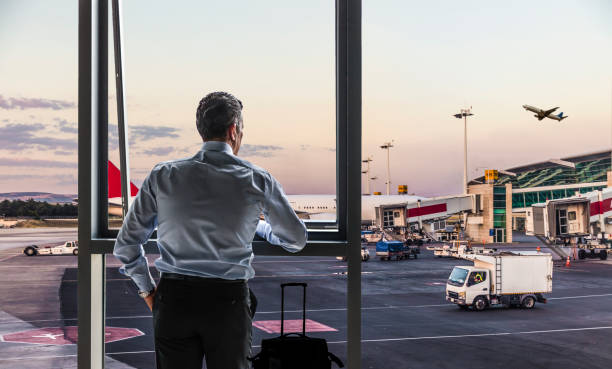 istock Man Waiting for Flight in Airport Lounge 1381238079
