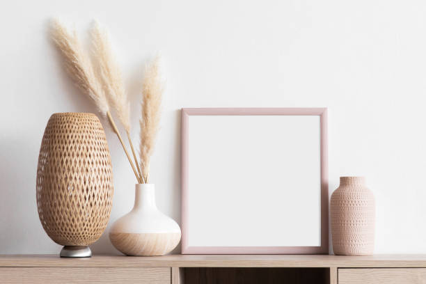 istock Artwork mock-up in interior design. Blank white picture frame on a wall, square shape 1381245616