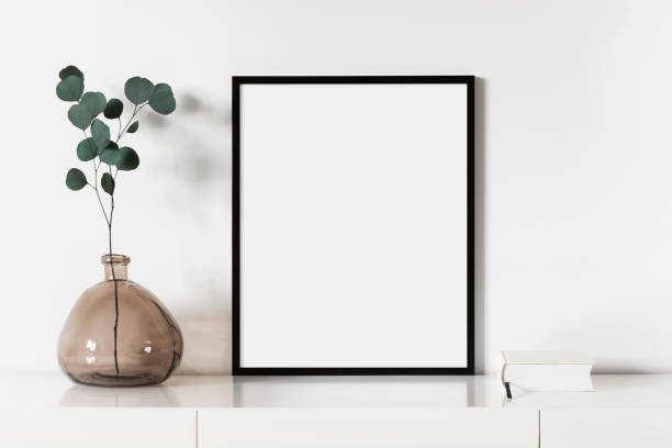 istock Artwork mock-up in interior design. Blank vertical picture frame on a cupboard 1381245624
