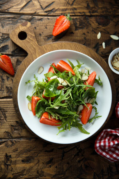 istock Arugula salad with strawberry 1381245640