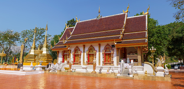 Two golden pagodas at Wat Phra That Doi Tung, Chiang Rai province, Thailand.