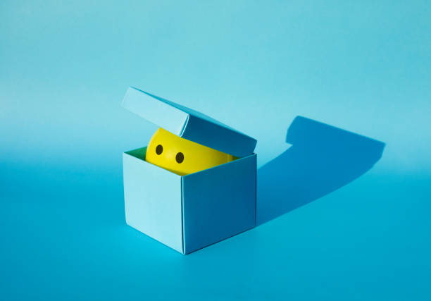 Yellow ball in box.gift or surprise concepts.funny background