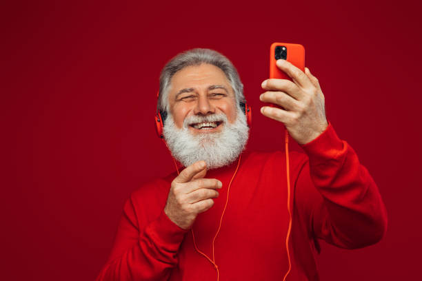 istock Portrait of emotional old man using smart phone 1381281778