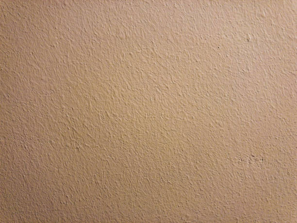 istock A white wallpaper wall as a background or texture. 1381290575