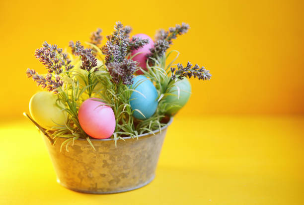 istock Easter. Yellow background. Multicolour easter eggs. Celebrate holidays 1381295460
