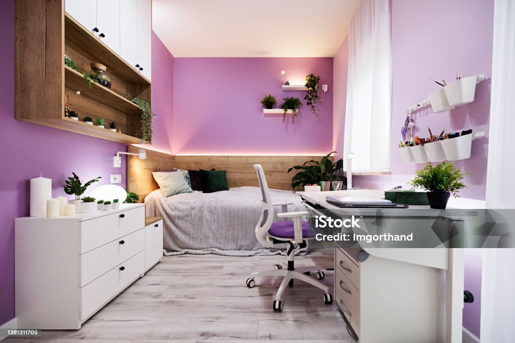 Modern, bright, teenager room Modern luxury teenage girl's bedroom with desk and lot of plants. Bright wooden floor and lot of lamps. 
Canon R5. Bedroom Stock Photo
