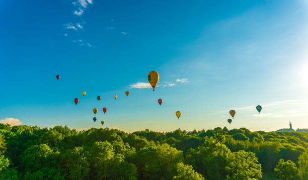 istock hot air balloons over rural landscape 1381339974