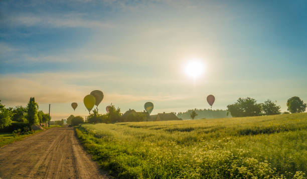 istock hot air balloon flying over the road 1381348506