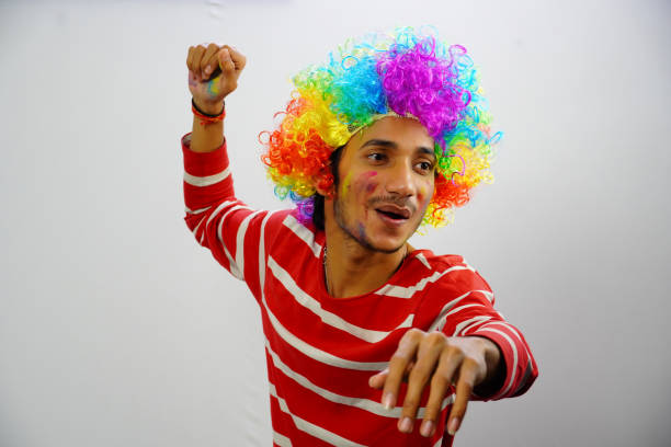 istock Young boy paying holi isolated BG 1381350661