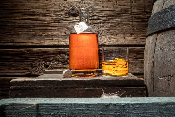istock Hand crafted cognac with ice in a glass. 1381353387