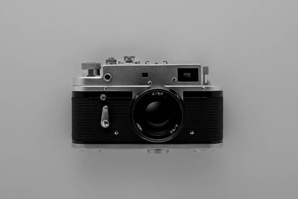 istock old photo camera on gray background. Wallpaper 1381356064