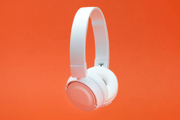 istock Headphones on the orange color background 1381356594