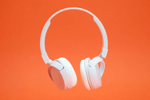 istock Headphones on the orange color background 1381358247