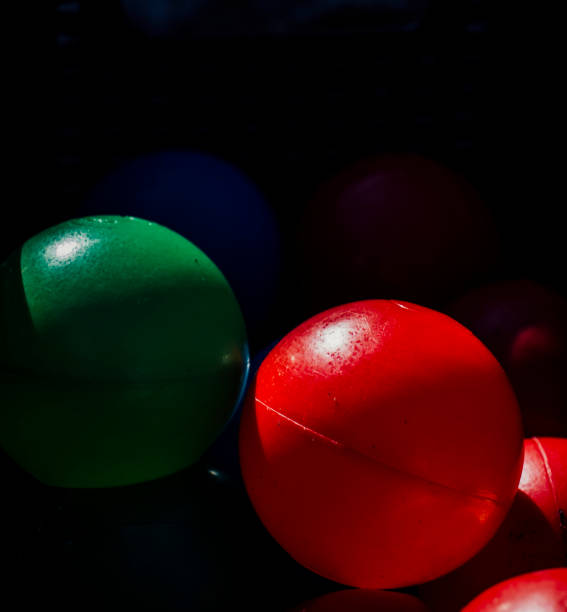 istock Red and green ball in the dark 1381364338