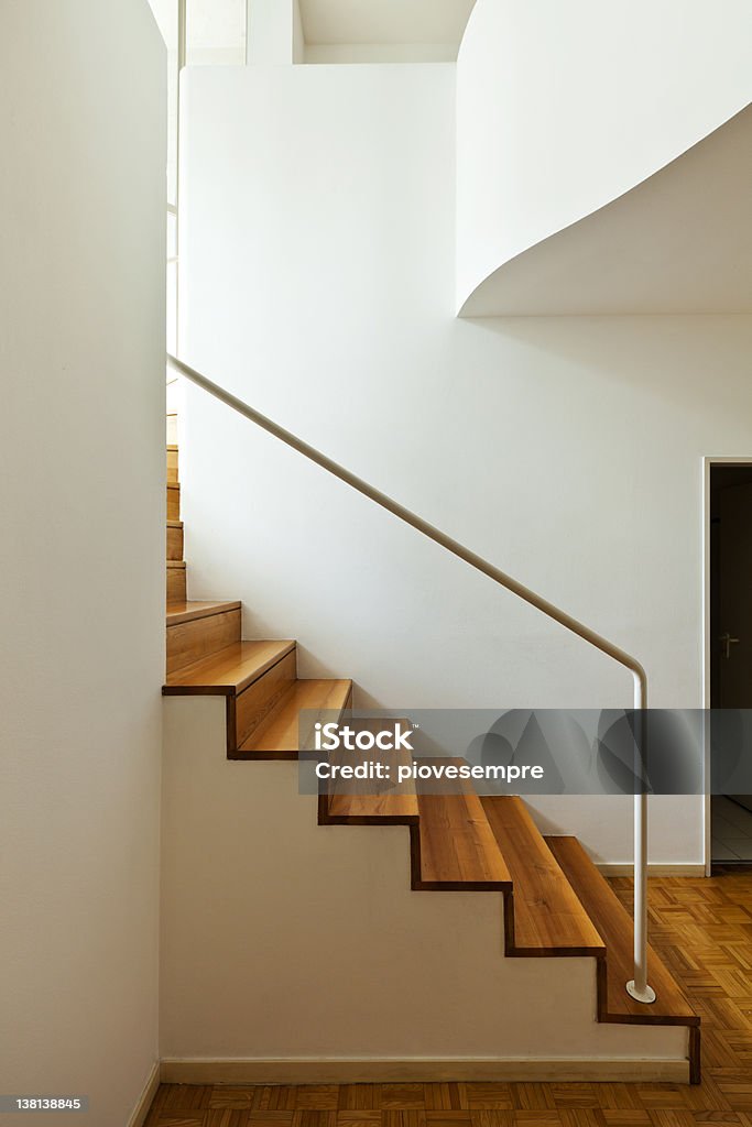 interior duplex, wooden stairs Bright duplex with hardwood floors,wooden stair Apartment Stock Photo