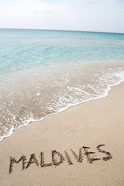 Maldives written on the sand stock photo