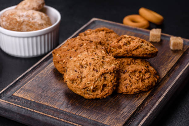 istock Tasty fresh oat cookies on a dark concrete background 1381406043