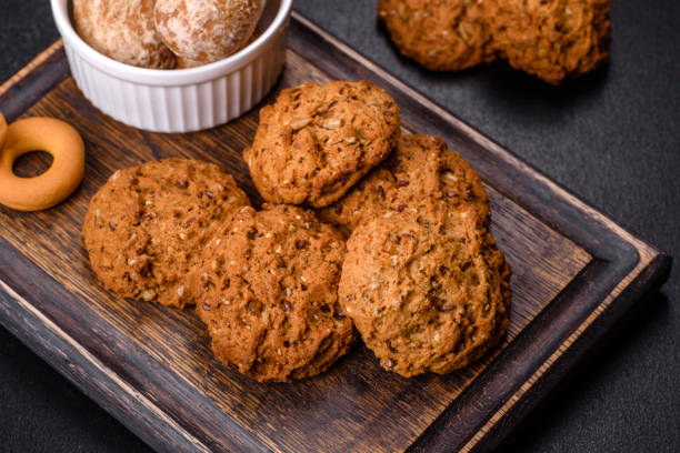 istock Tasty fresh oat cookies on a dark concrete background 1381413151