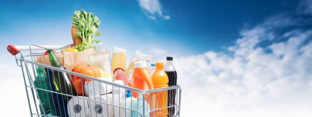 istock Full shopping cart and blue sky 1381420168