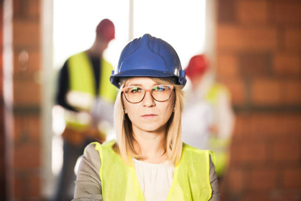 istock worker, investor, inspector or architect with her team. construction site engineers on site. satisfied expression 1381421861