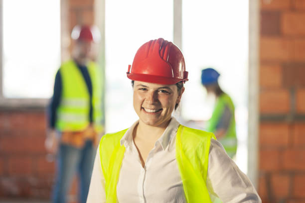istock worker, investor, inspector or architect with her team. construction site engineers on site. satisfied expression 1381421877