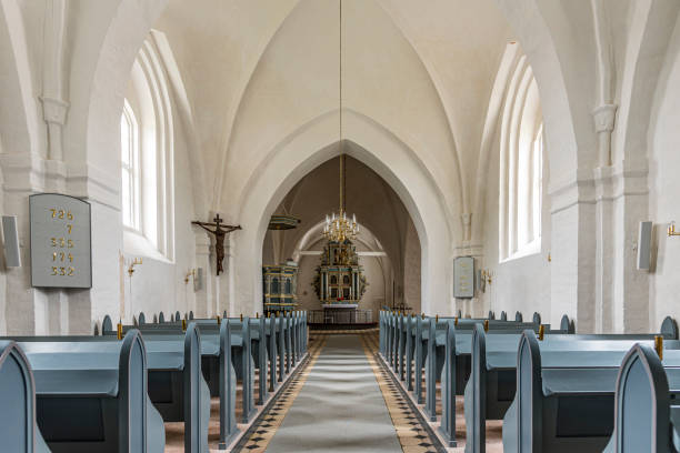 the interior of a white and grey scandinavian church stock photo