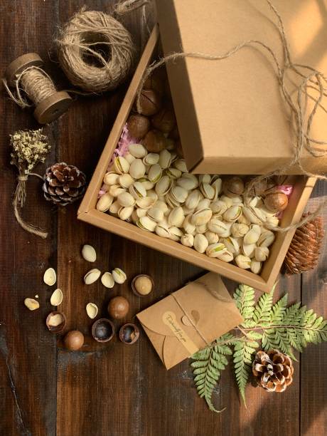 istock Pistachios and macadamia in a box 1381437073