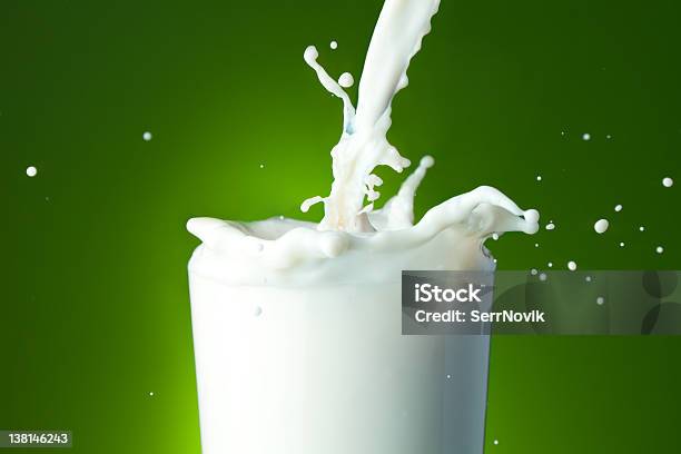 Filling The Glass With Milk Stock Photo - Download Image Now - Clean, Close-up, Concepts