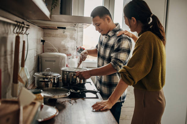 istock Man cooking for wife 1381466032