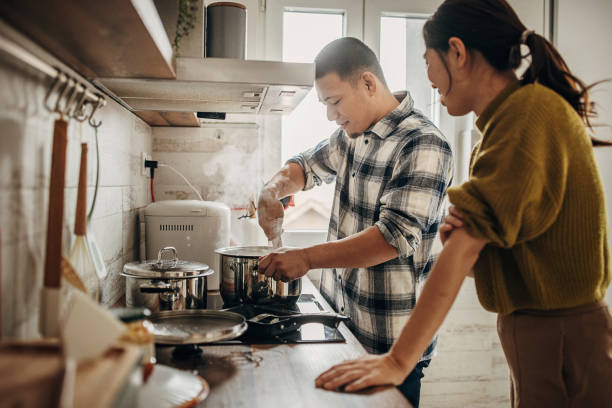 istock Man cooking for wife 1381466496