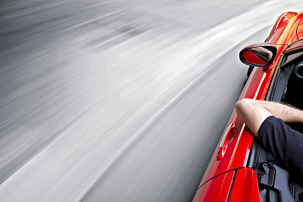 istock Driving a red car around a curve 138146666