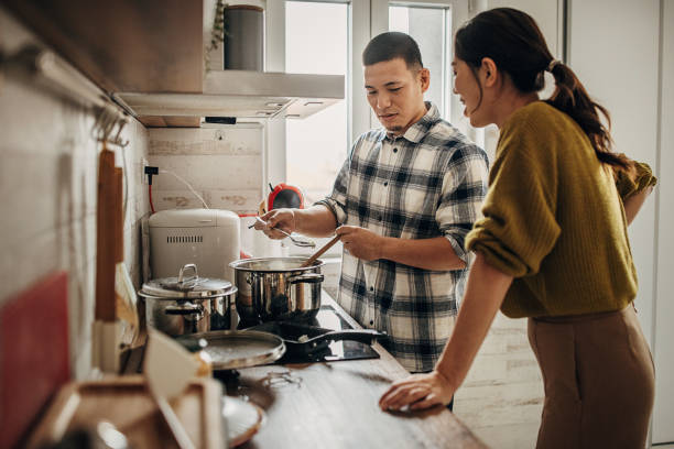 istock Husband cooking for wife 1381467169