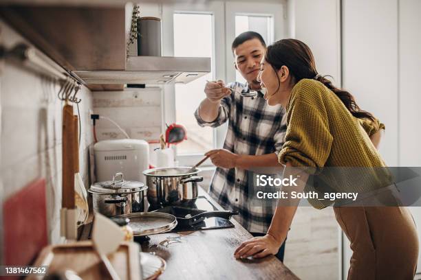 Man Cooking For Wife Stock Photo - Download Image Now - Cooking, Couple - Relationship, Domestic Life