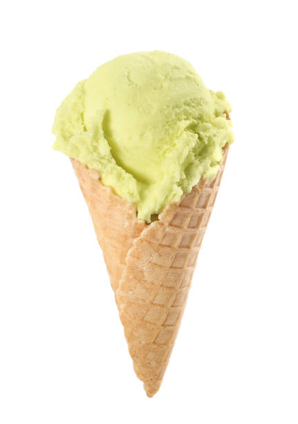 istock Delicious yellow ice cream in waffle cone isolated on white 1381483808