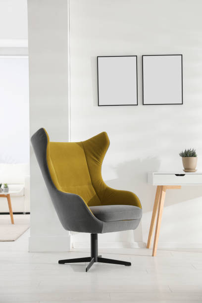 istock Stylish room interior with empty posters on wall. Mockup for design 1381492182