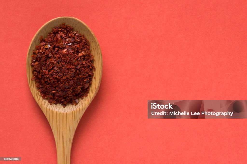 Aleppo Peppers on a Wood Spoon Food Stock Photo