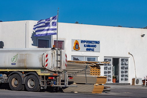 Firá Fire Station on Santorini in Cyclades Islands, Greece, with commercial logos visible