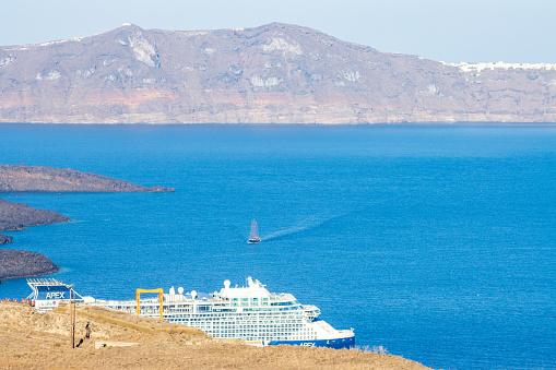 Celebrity Apex Cruise Ship on Santorini Caldera in South Aegean Sea, Greece. It was launched in May 2019.