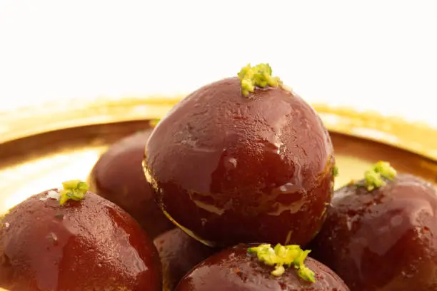 Photo of Kala Jamun Also Called Dark Gulab Jamun Is Milk Solids Based Mithai Made of Mashed Khoya Grated Paneer Elaichi Khoa Panir In Cheeni Ki Chasni. Food Theme For Holi, Deepawali, Rakshabandhan, Dussehra