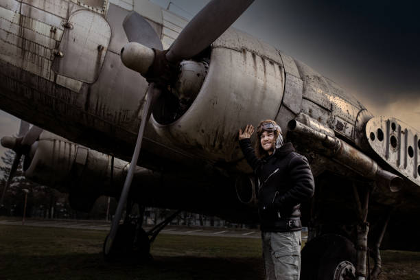 istock A young manposes in an airplane cemeteryas an old-fashioned pilot 1381542764