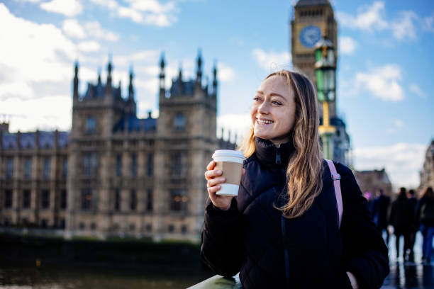 istock Woman having fun on Westminster Bridge 1381567663