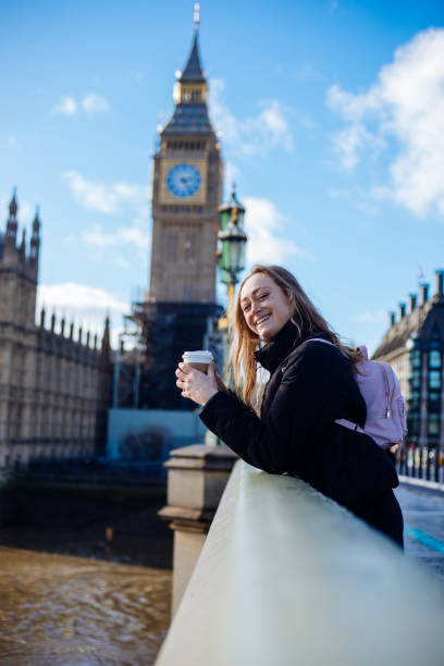 istock Woman having fun on Westminster Bridge 1381567692