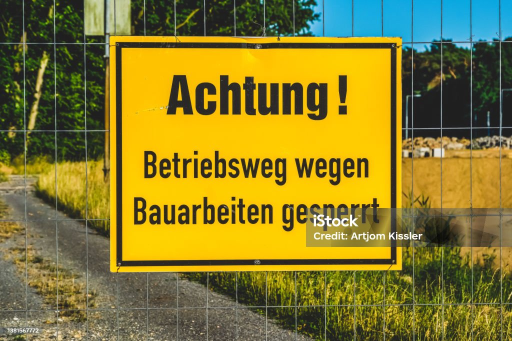 A sign with the note "Attention! Operating route closed due to construction work" Danger Stock Photo