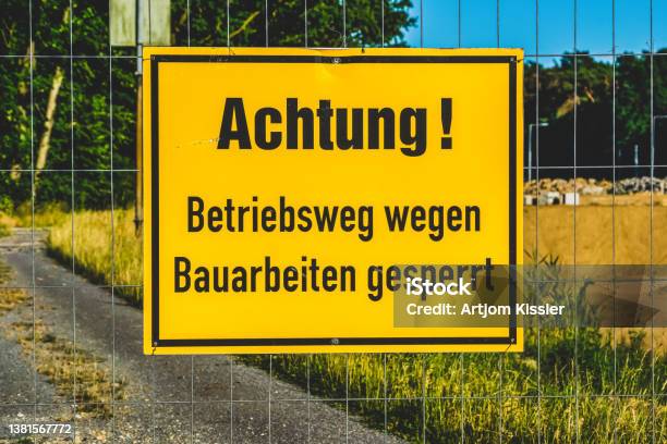 A Sign With The Note Attention Operating Route Closed Due To Construction Work Stock Photo - Download Image Now