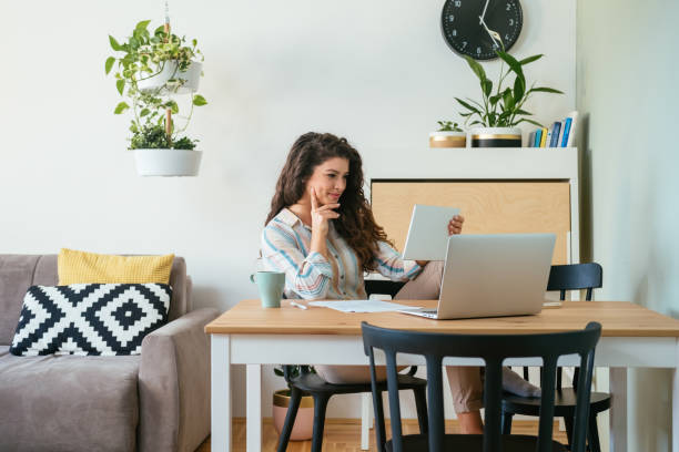 istock Happy Business Woman Using Digital Tablet at Home 1381568390