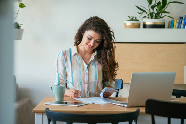 istock Smiling Businesswoman Working at Home Office 1381568393
