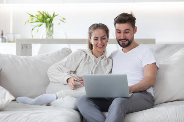 istock Happy married couple with laptop 1381572054