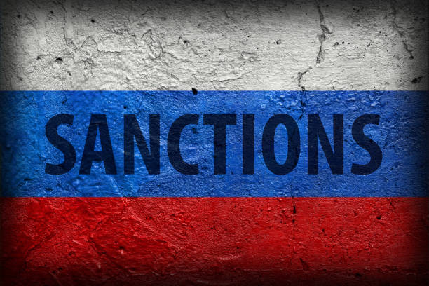 istock Sanctions on Russia symobol concrete wall background 1381573729