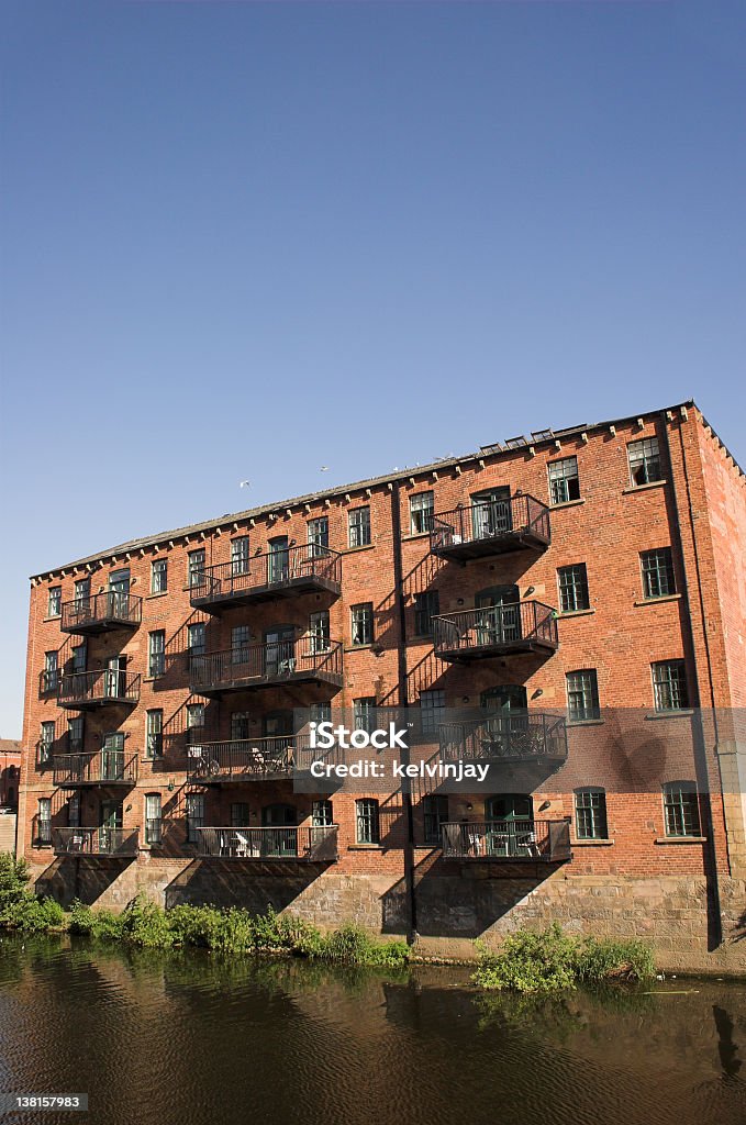 Converted warehouse flats by the river in Leeds Converted warehouse flats by the river in Leeds.  Change Stock Photo